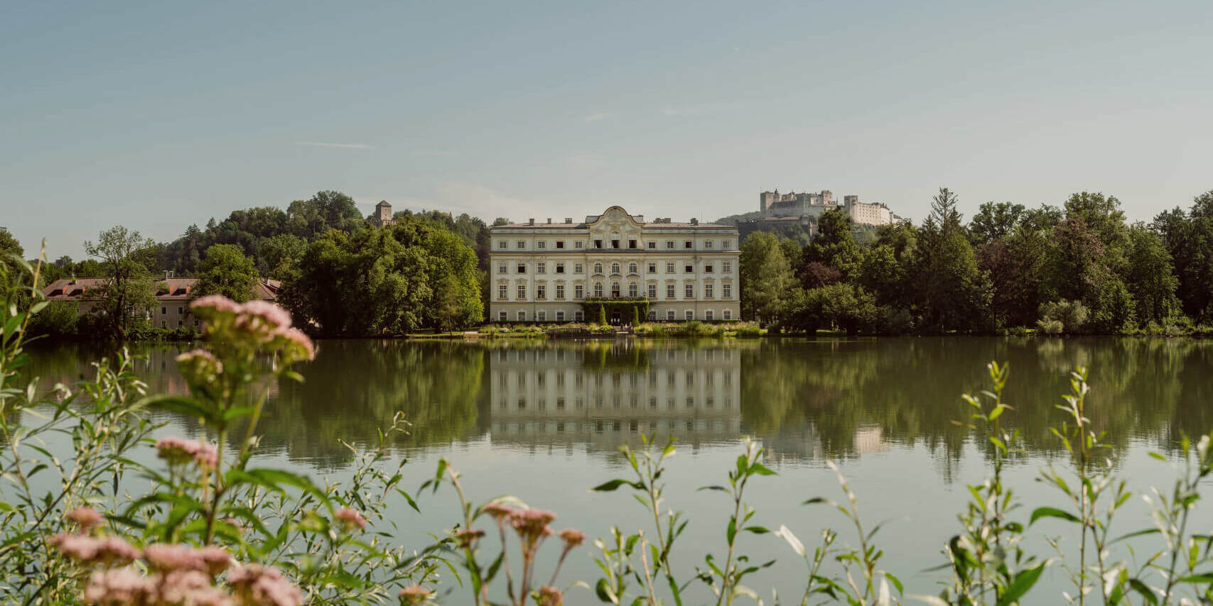 Panoramic shot of Hohensalzburg Fortress above a beautiful lake © Tourismus Salzburg GmbH / Patrick Langwallner