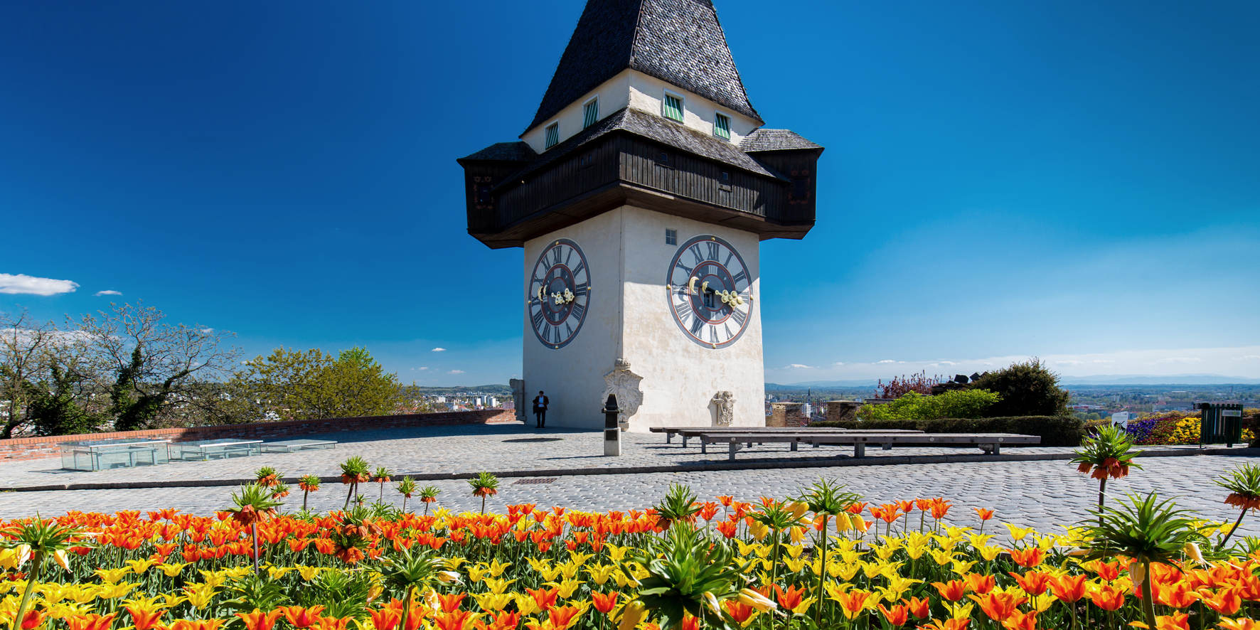 Graz - clock tower in spring © Graz Tourismus | Harry Schiffer