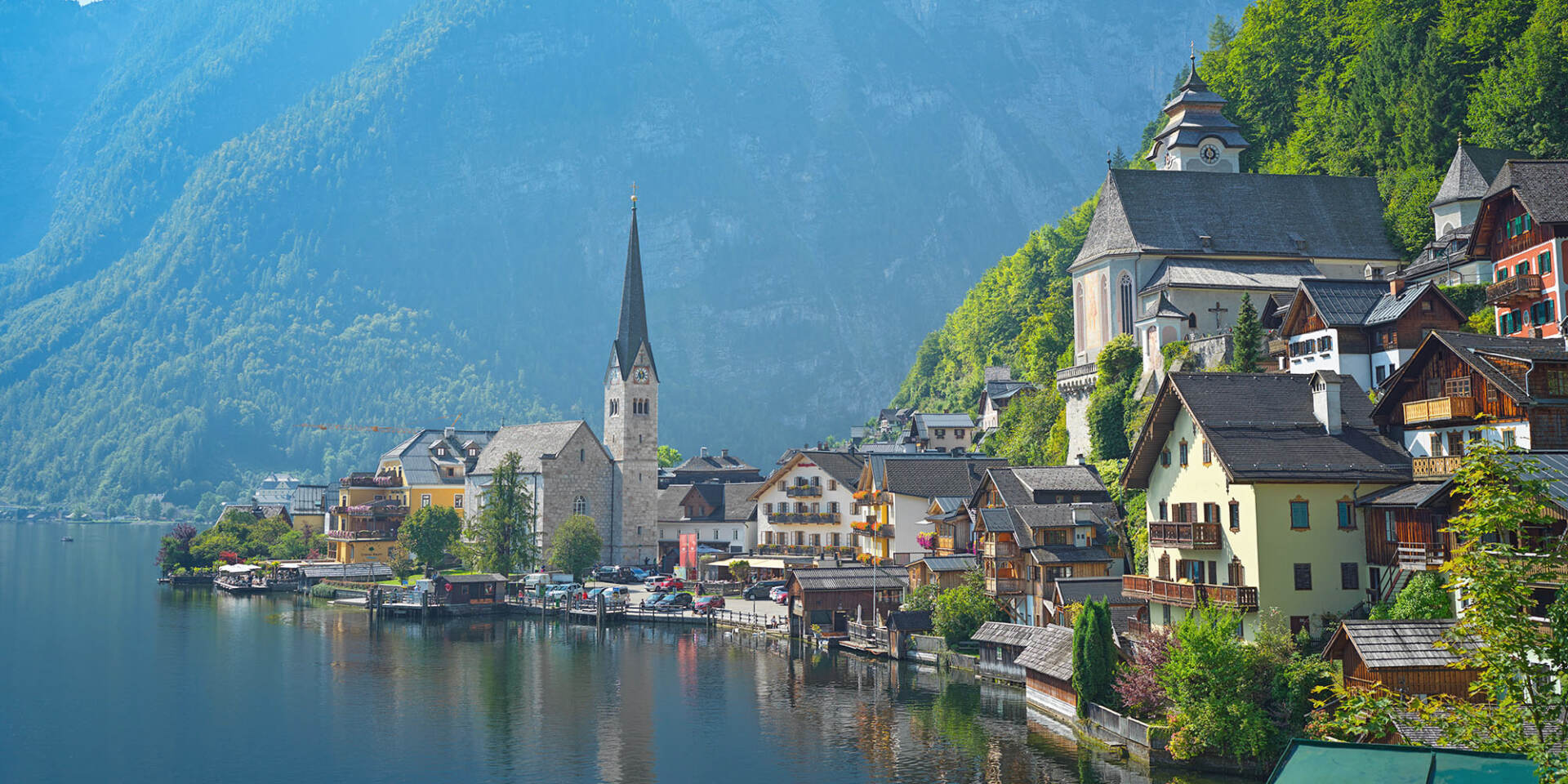 Hallstatt - View of the town with the church, next to it Lake Hallstatt and the mountains - Hallstatt Tour with Salzburg Panorama Tours