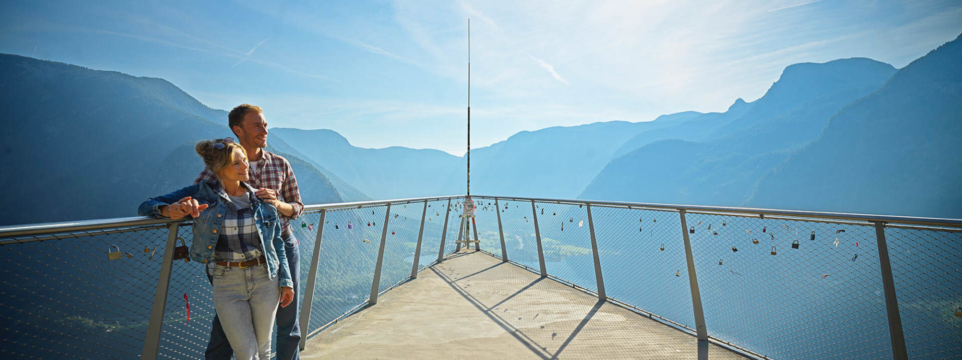Hallstatt - Couple stands at the Skywalk World Heritage View with panoramic view of the mountains - Hallstatt Tour with Salzburg Panorama Tours