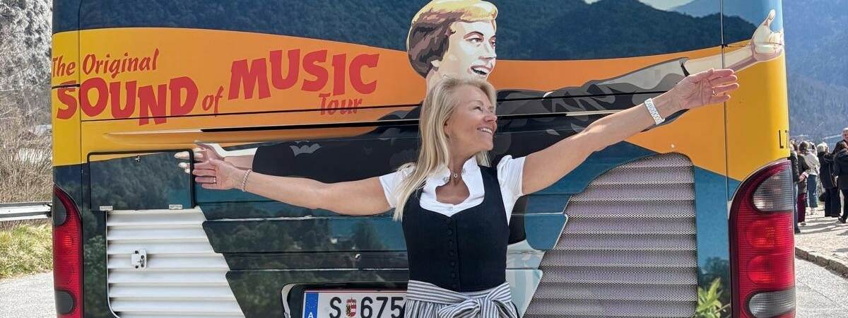 Female Guide in front of Panorama Tours tour bus during Sound of Music Tour